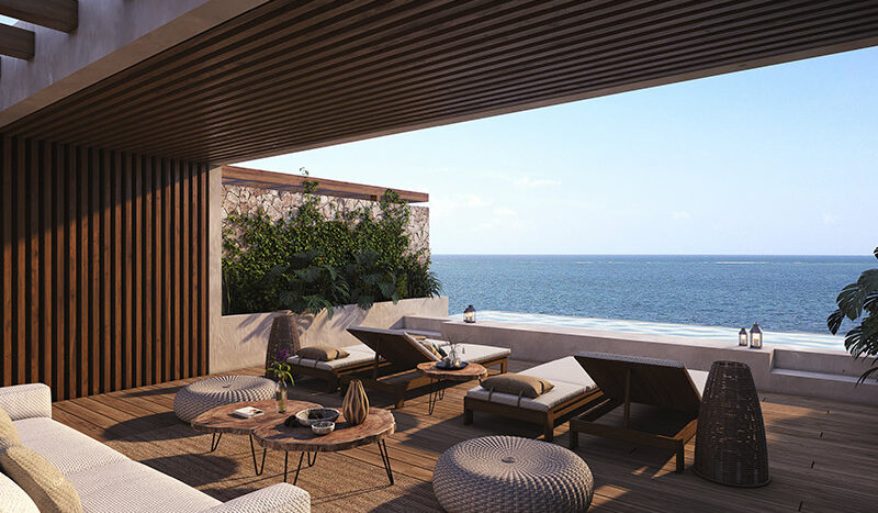 Foto del roof garden en el condominio Nalu Luxury Beachfront Residences, un espacio al aire libre en la azotea con vista panorámica del mar, equipado con mobiliario y área de barbacoa para disfrutar de momentos únicos.