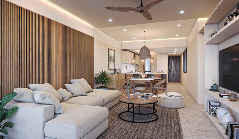 Sala y comedor amplios en el Condominio Nalu Luxury Beachfront Residences con vista al mar, mobiliario de alta calidad